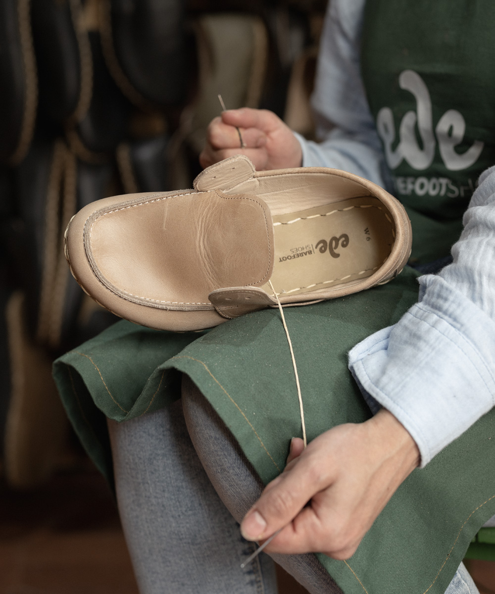 Hand-stitching the sole of a barefoot loafer at THE SHOE ATELIER