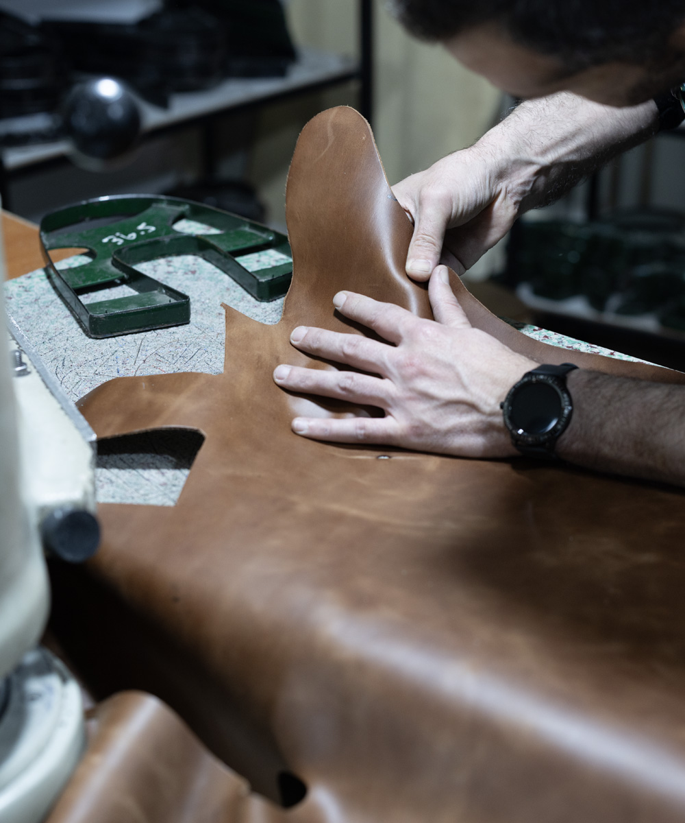 Craftsman cutting full-grain leather at THE SHOE ATELIER